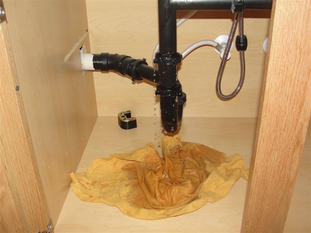 kitchen faucet hose leaking under sink