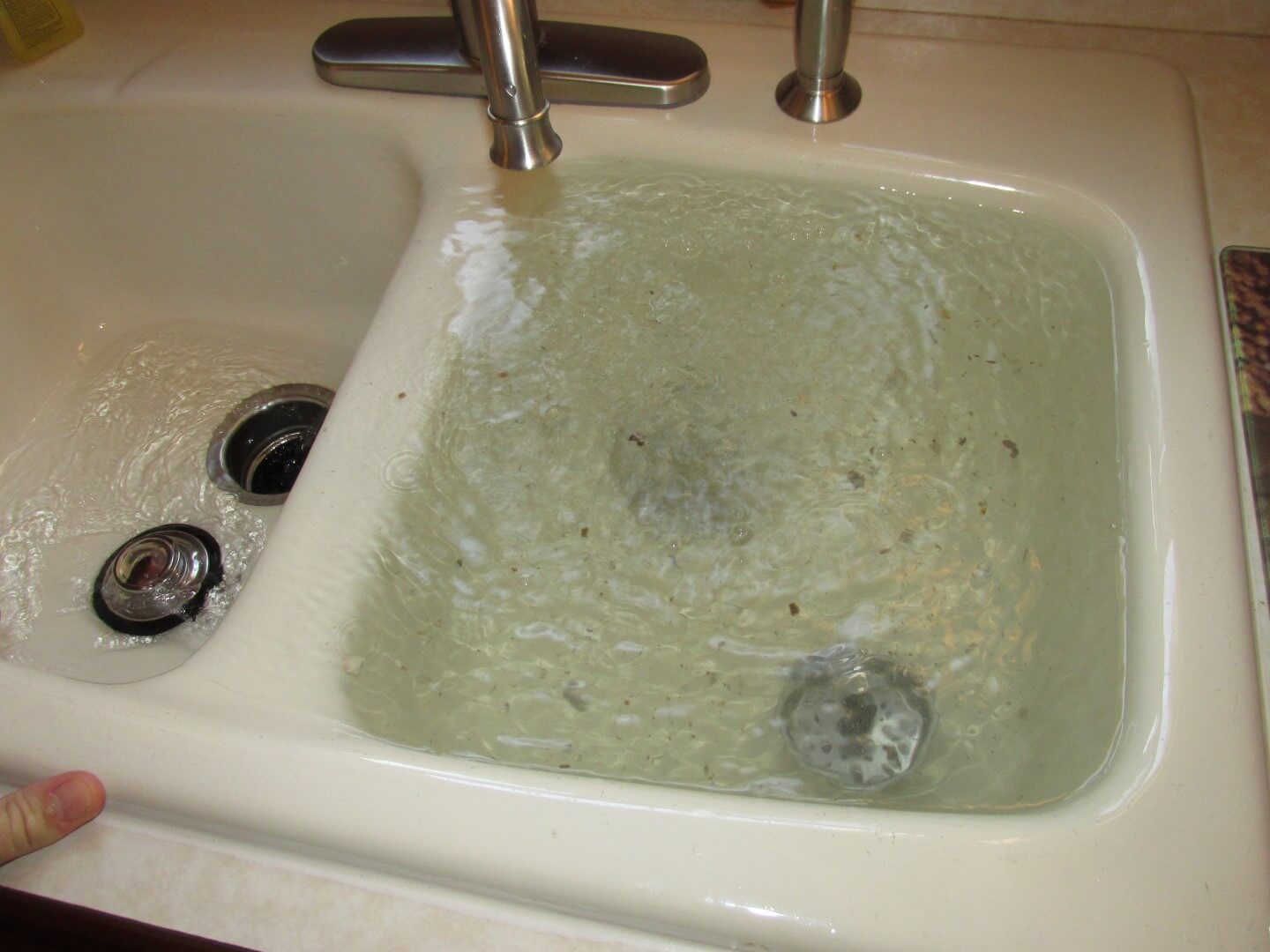 sink clogged water coming up