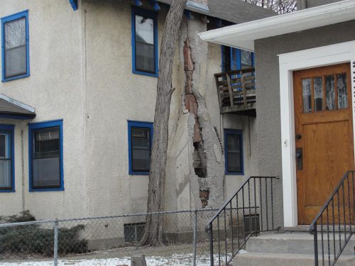 Stucco-covered chimney damage